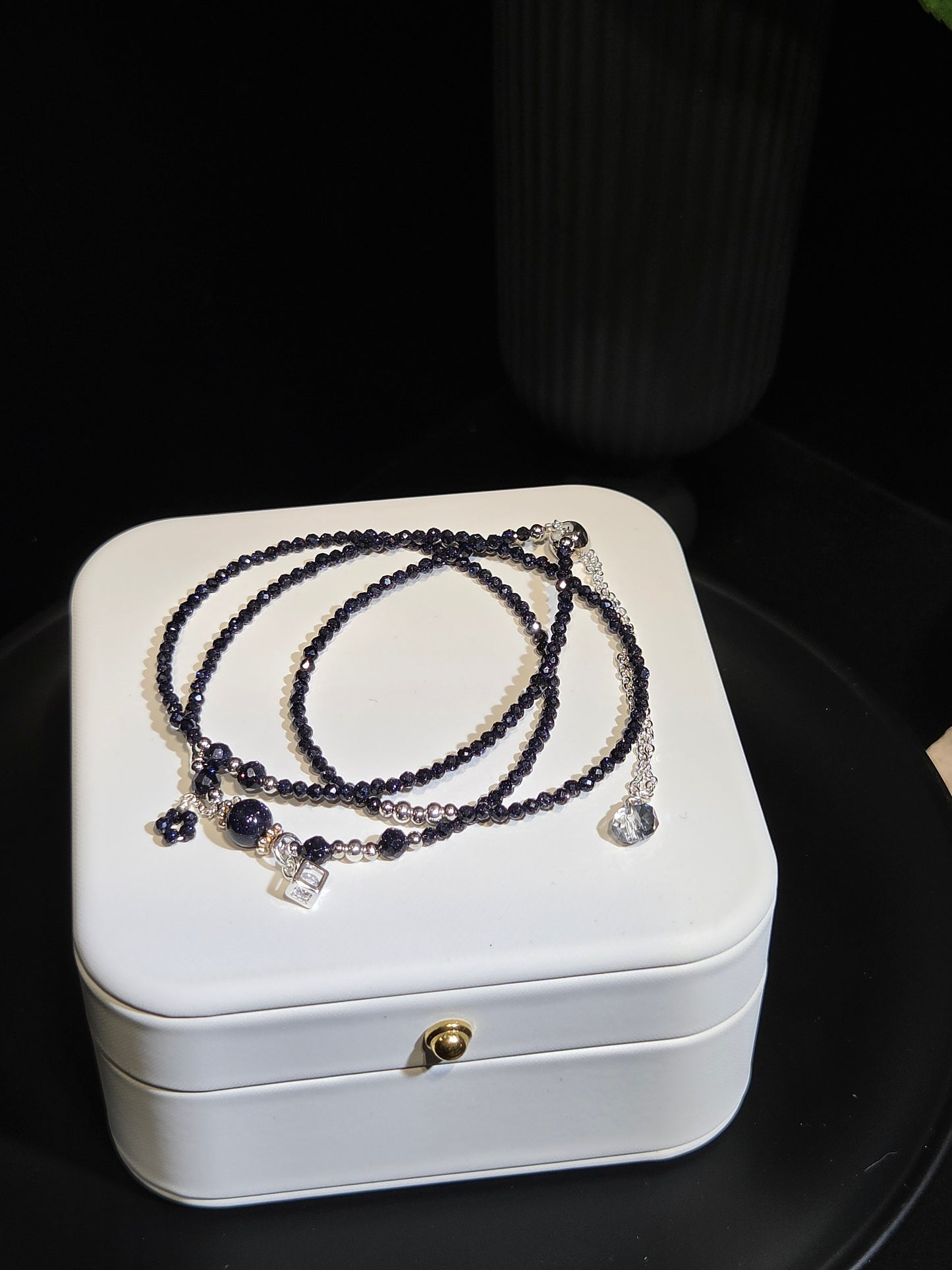 Midnight Blue Sandstone Beaded Bracelet in a white jewelry box