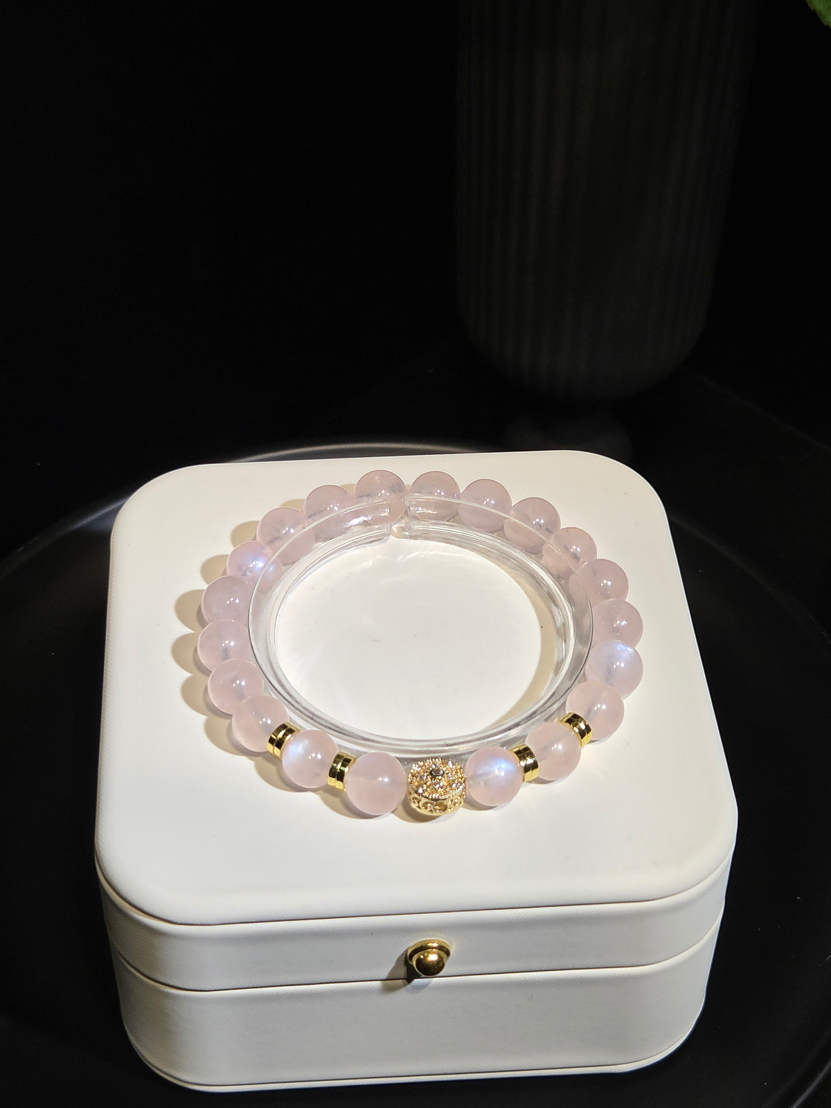 Rose Quartz Beaded Bracelet with Gold Accents in a white jewelry box
