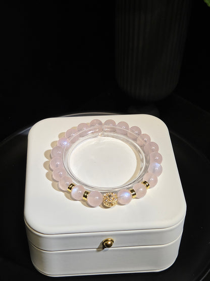 Rose Quartz Beaded Bracelet with Gold Accents in a white jewelry box