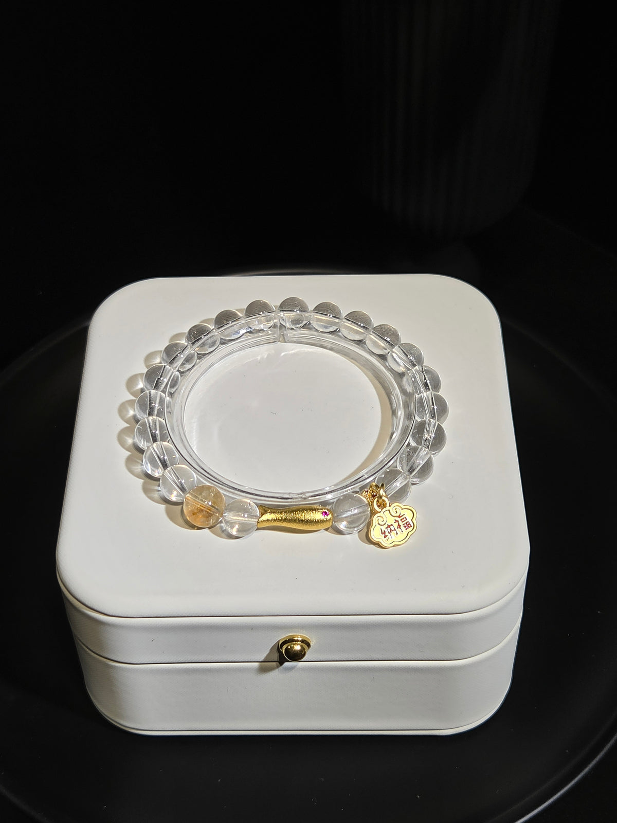 Clear Quartz Beaded Bracelet with Gold Charm in a white jewelry box