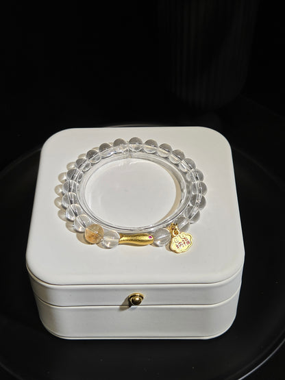 Clear Quartz Beaded Bracelet with Gold Charm in a white jewelry box