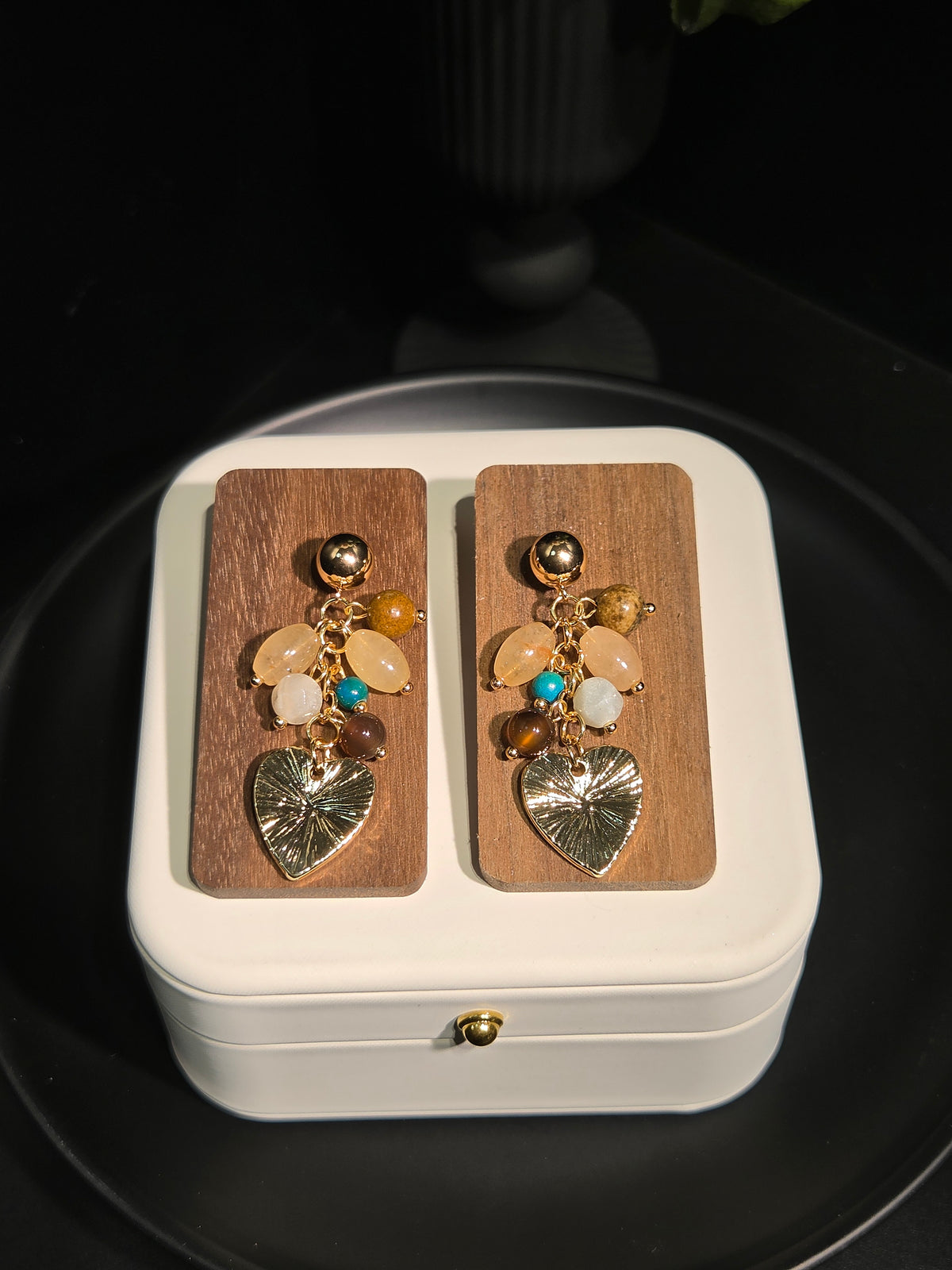 Light luxury natural gemstone cluster heart drop earrings on wooden display