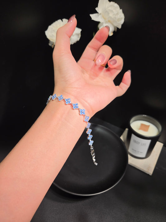 Light luxury icy blue clover floral crystal tennis bracelet worn on wrist