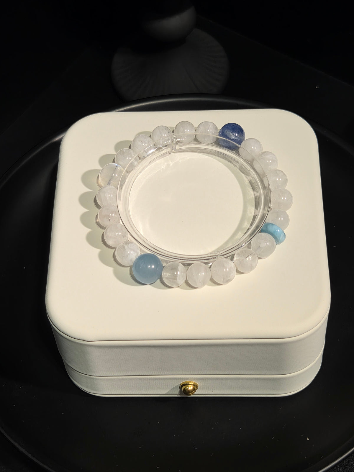 Light luxury white moonstone and aquamarine beaded crystal bracelet on display stand