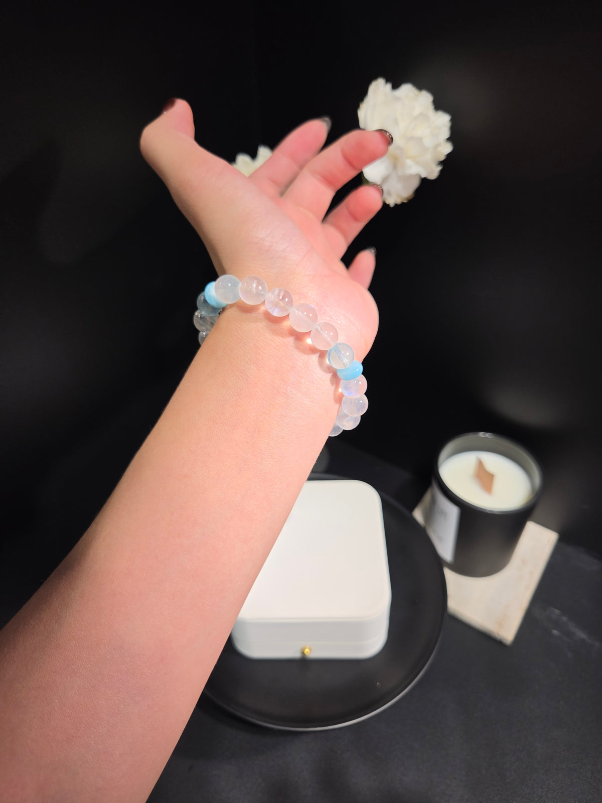 Light luxury blue sheen moonstone and aquamarine beaded crystal bracelet on wrist